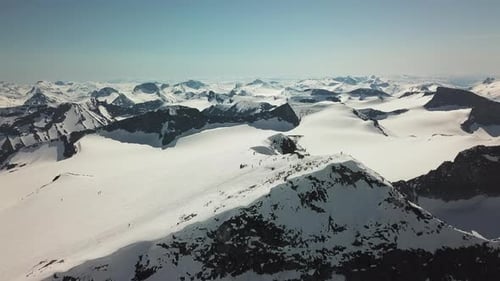 Aerial shot of the summit of Galdhøpiggen, the highest mountain in Norway, on a beautiful sunny day