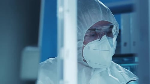 Microelectronics Engineer Works in a Modern Scientific Laboratory on Computing Systems and