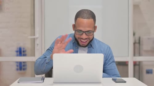 Young Adult on Video Call in Office