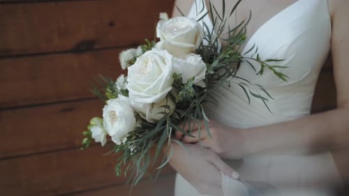 Bouquet of White Roses Held by a Woman