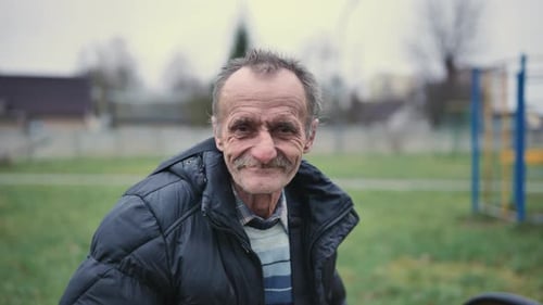 Portrait of an Elderly Man Relaxing in a Beautiful Park Embracing Nature and Life