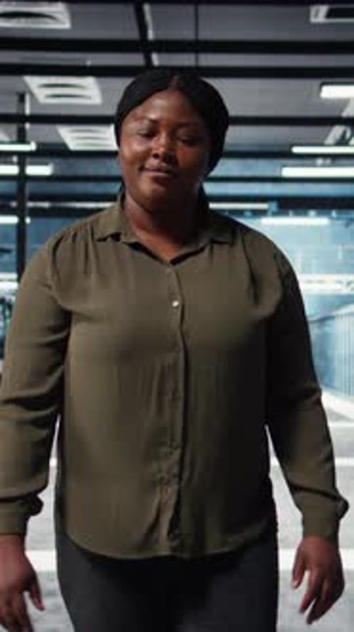 Vertical Video Software Developer Walking in Data Center Checking Hardware