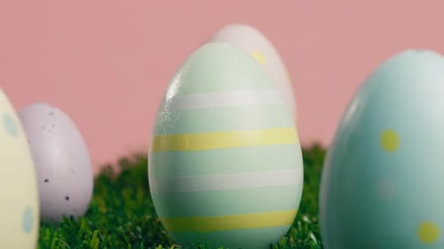 Rotating Painted Easter Eggs on Green