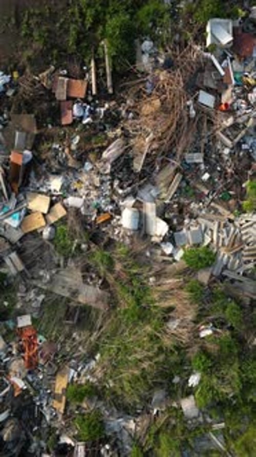 Aerial View Capturing Expansive Landfill Site Highlighting Widespread Waste Accumulation and Severe