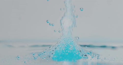 Slow motion macro of blue micro particles molecules in a liquid are analyzed with microscope for r