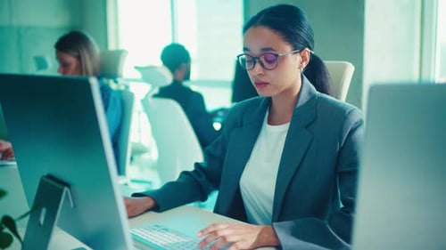 Dedicated and Focused Professional Working in a Modern Office