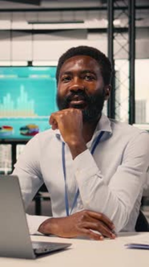 Vertical Video Portrait of African American Businessman Analyzing KPI Metrics and Insights