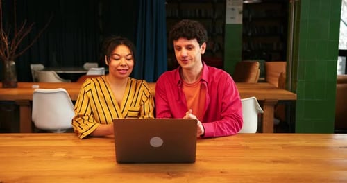 Smiling Positive Businesswoman and Businessman Working Together in Modern Office Having Video Call
