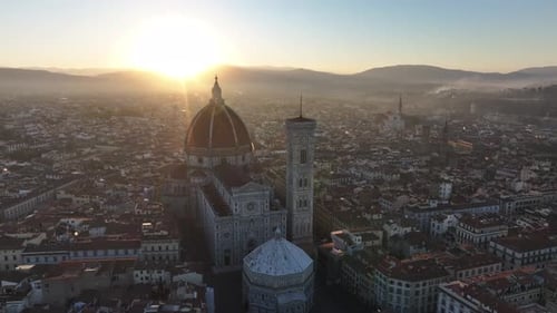 Florence Duomo and cityscape at golden sunrise cinematic aerial view