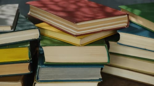 Stacks of Colorful Books Close Up