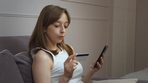 Woman Shopping Online Using Mobile Phone