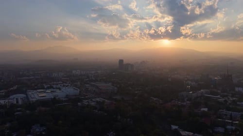 Nostalgic dusk over Mexico City seen from above by drone