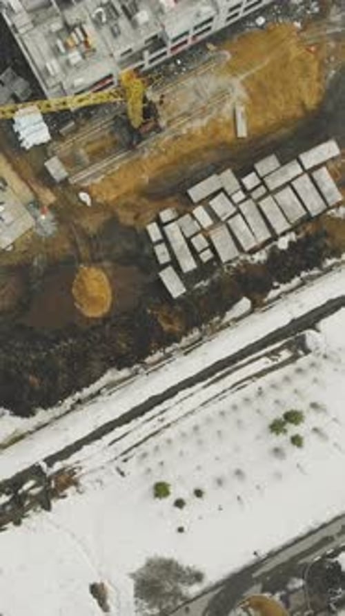 Abandoned Industrial Site Covered with Thick Snow Layer