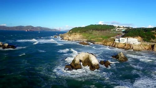 Drone View Of Choppy Ocean And Rocks By San Francisco Beachside 5
