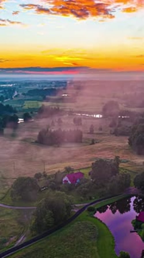 Picturesque Sunrise Over the Rolling Countryside from Above
