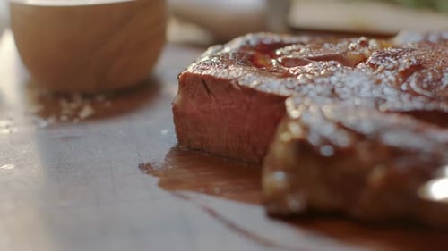 Delicious steak cooking on cutting board close up
