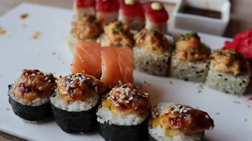The video an assortment of Japanese sushi rolls, showcasing the exquisite