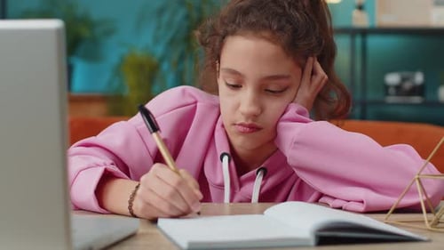 Preteen School Girl Using Laptop for Online Lesson Doing Homework Distance Learning Education