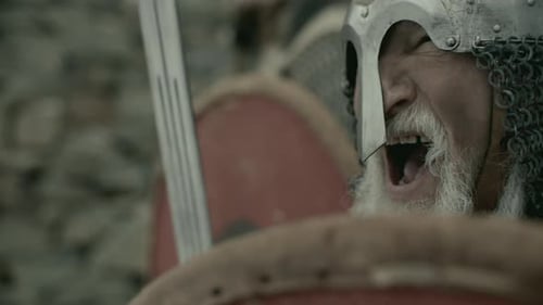 Senior Man in Armor with Beard Yelling