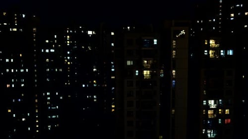 Apartment Buildings Lit Up at Night