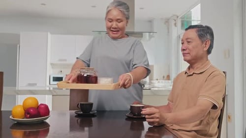 Senior Couple Enjoying Tea Together at Home