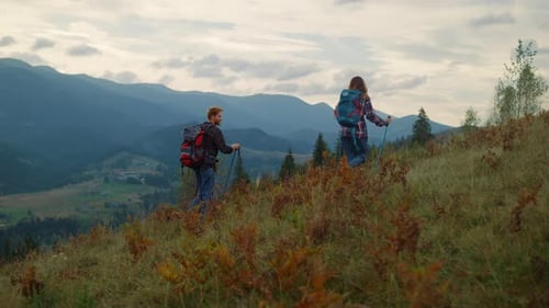 Backpacking Couple Climb Mountains. Two Hikers Walk Together on Travel Activity Outdoors
