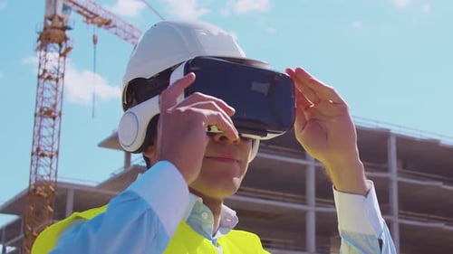 Construction Worker Wearing VR Headset at Construction Site