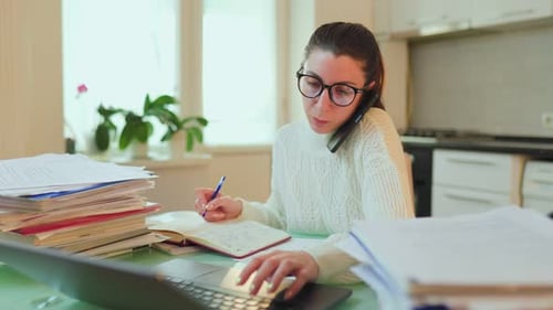 Work and Chat Tired Woman Takes a Break Talking on Phone at Home Office