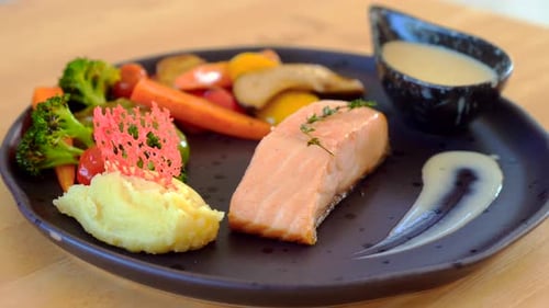 Prepared Salmon Fillet Dish on Plate with Vegetables
