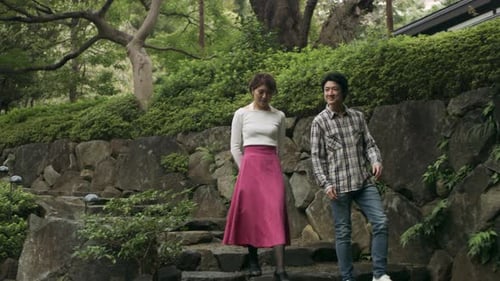 Happy young asian couple strolling through a beautiful garden in Japan