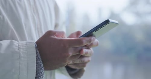 Hands Using Modern Mobile Phone Close Up