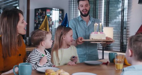 Family Celebrating a Birthday Together Indoors