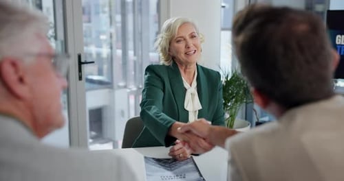 Businesswoman Handshake at Corporate Meeting in Office