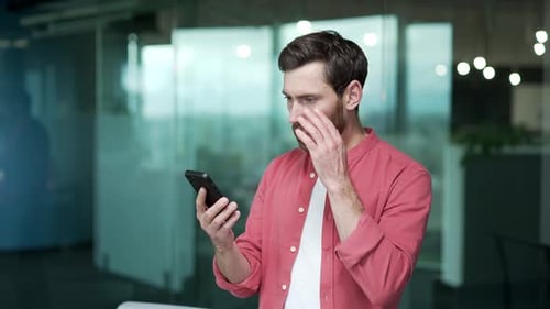 Sad mature business man receive message with bank financial problems failure with deal on cellphone