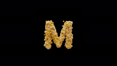 Letter M Forms From Yellow Corn Kernels