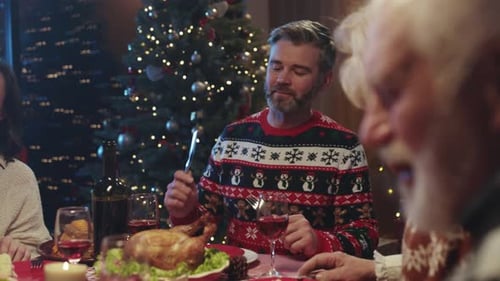 Family Celebrates Christmas at Home With Dinner