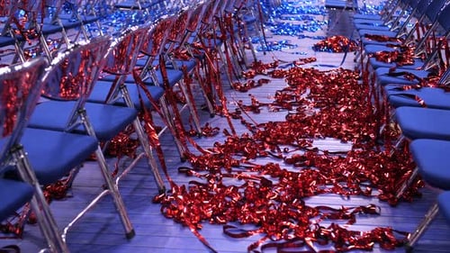 Red and Blue Confetti on Floor After Event