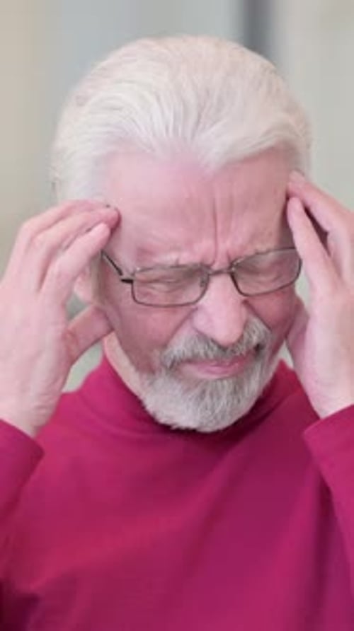 Senior Man Experiencing Headache or Migraine Pain