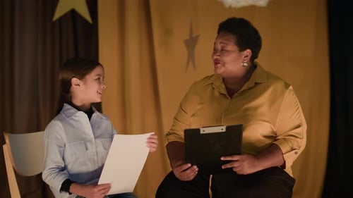 Senior Theatre Director Working With Girl
