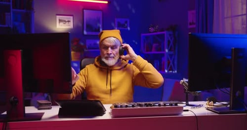 Man Mixing Music With Technology at Desk