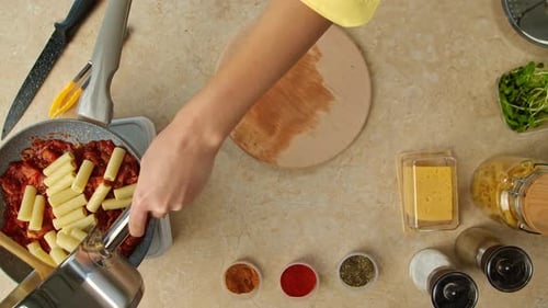 Pasta and Tomato Sauce Preparation from Above