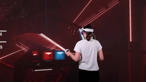 Woman Plays Energetic Virtual Reality Slasher Game