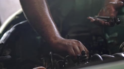 Bolts Removed From Old Car Engine In Repair Shop