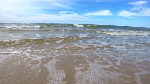 Peaceful Ocean Waves on Sandy Beach.