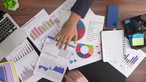 Team Collaboration in Office with Business Reports on Desk