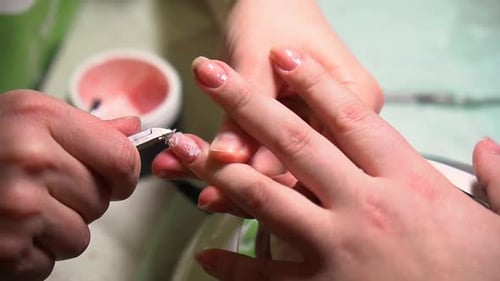 Beautiful woman cut nail by small scissor, manicure and painting, cleaning paint.