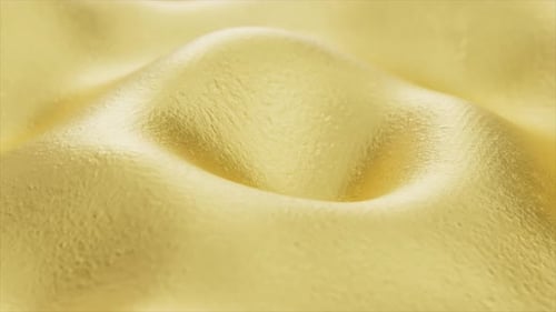 Golden Textured Background with a Liquid Metal Surface Undulating and Rippling in a Seamless Loop