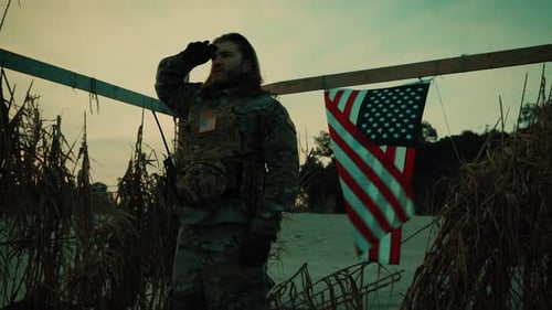 American Flag on Memorial Day and Soldier Honoring Fallen Soldiers in Desert