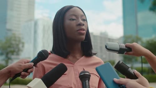 Young Famous Female Politician Giving Interview to Journalists at Street