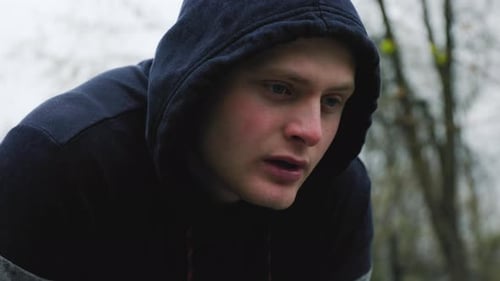 Young Adult Man in Hoodie Outdoors